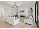 Bright and airy living room featuring a modern fireplace, decorative lighting, and built-in shelving at 3871 Sawyers Island Dr, Mount Pleasant, SC 29466
