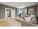 Living room with a large sectional sofa and decoratively framed pictures at 3871 Sawyers Island Dr, Mount Pleasant, SC 29466