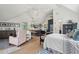 Combined bedroom, living room, and kitchen with shiplap, white walls, and natural lighting creates a homey atmosphere at 3871 Sawyers Island Dr, Mount Pleasant, SC 29466