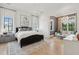 Spacious main bedroom showcasing hardwood floors and an attached sitting room at 3871 Sawyers Island Dr, Mount Pleasant, SC 29466
