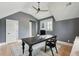 Office with desk, vaulted ceiling, dark gray walls, hardwood floor, ceiling fan, and black framed window at 3871 Sawyers Island Dr, Mount Pleasant, SC 29466