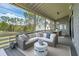 Inviting screened-in porch with comfortable seating and outdoor dining area at 3871 Sawyers Island Dr, Mount Pleasant, SC 29466