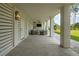 Covered outdoor patio with seating, outdoor TV and ceiling fan, perfect for entertaining at 3871 Sawyers Island Dr, Mount Pleasant, SC 29466