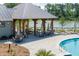 Relaxing community pavilion with picnic tables, lounge chairs, and tranquil lakeside views at 3871 Sawyers Island Dr, Mount Pleasant, SC 29466