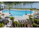 Beautiful community pool with ample seating, a splash pad, and palm trees for the perfect oasis at 3871 Sawyers Island Dr, Mount Pleasant, SC 29466