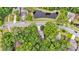 Aerial shot of a house near a street and a pond, surrounded by trees and neighborhood homes at 3873 Hanoverian Dr, Mount Pleasant, SC 29429