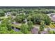 Aerial view of a house surrounded by trees and a nearby pond at 3873 Hanoverian Dr, Mount Pleasant, SC 29429