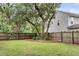 Large backyard with a wooden fence and mature trees at 3873 Hanoverian Dr, Mount Pleasant, SC 29429