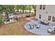 Backyard area featuring a patio with a fire pit and picnic table, a playhouse, and a wooden fence at 3873 Hanoverian Dr, Mount Pleasant, SC 29429