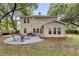 The backyard features patio, dining area and seating around a fire pit at 3873 Hanoverian Dr, Mount Pleasant, SC 29429