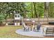 Backyard with patio, playhouse, fire pit, and string lights at 3873 Hanoverian Dr, Mount Pleasant, SC 29429
