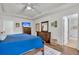 Comfortable bedroom with a blue comforter, dressers, and ensuite bathroom at 3873 Hanoverian Dr, Mount Pleasant, SC 29429