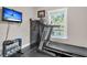 View of the exercise room featuring a treadmill, weights, tv, and a safe for valuables at 3873 Hanoverian Dr, Mount Pleasant, SC 29429
