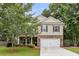 Charming two-story home with stone accents, neutral siding, and an attached two car garage at 3873 Hanoverian Dr, Mount Pleasant, SC 29429