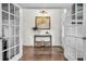 Entryway foyer with wood floors, a map hanging, decorative baskets, and white french doors at 3873 Hanoverian Dr, Mount Pleasant, SC 29429