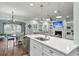 Kitchen island with a sink, stainless steel appliances, and an open view to the living room at 3873 Hanoverian Dr, Mount Pleasant, SC 29429