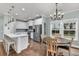 Open concept kitchen and dining area with stainless steel appliances and wooden table at 3873 Hanoverian Dr, Mount Pleasant, SC 29429