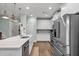 Bright kitchen with white cabinets, stainless steel appliances, and hardwood floors at 3873 Hanoverian Dr, Mount Pleasant, SC 29429