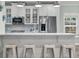 Modern kitchen featuring a quartz countertop island, stainless appliances, and bar stool seating at 3873 Hanoverian Dr, Mount Pleasant, SC 29429