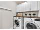 Laundry room features LG washer and dryer with white cabinets at 3873 Hanoverian Dr, Mount Pleasant, SC 29429
