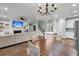 Open-concept living space with fireplace, kitchen island, and dining table at 3873 Hanoverian Dr, Mount Pleasant, SC 29429