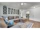 Living room featuring a large sectional couch and a laundry room in the background at 3873 Hanoverian Dr, Mount Pleasant, SC 29429