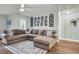 Spacious living room with a large sectional couch, decorative wall art, and a ceiling fan at 3873 Hanoverian Dr, Mount Pleasant, SC 29429