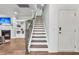 View of the home staircase with hardwood treads and white risers, complimented by a wood handrail and iron balusters at 3873 Hanoverian Dr, Mount Pleasant, SC 29429