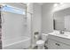 Clean bathroom featuring a shower-tub combo and white cabinets at 404 Bowstring Dr, Huger, SC 29450