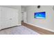 Bedroom featuring wood-look flooring, white walls, and modern fixtures at 404 Bowstring Dr, Huger, SC 29450