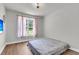Bedroom featuring wood-look flooring, a light fixture, and natural light at 404 Bowstring Dr, Huger, SC 29450