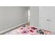 Bedroom featuring a glimpse of another room, closet, and floral bedding at 404 Bowstring Dr, Huger, SC 29450