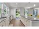 Bright, updated kitchen with granite countertops, and hardwood floors, opens to the backyard with access to outdoor enjoyment at 404 Bowstring Dr, Huger, SC 29450