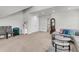 Spacious living room featuring a comfortable couch, a clear glass coffee table, and plenty of natural light at 404 Bowstring Dr, Huger, SC 29450