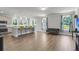 Open floor plan combining living area and eat-in kitchen with stainless appliances at 404 Bowstring Dr, Huger, SC 29450