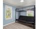 Simple bedroom with a metal bunk bed frame and neutral flooring, great for a room or guest space at 407 Raysor St, Saint George, SC 29477