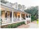 Inviting home with a classic front porch, dormer windows, and meticulous landscaping at 4150 Nature View Cir, Johns Island, SC 29455