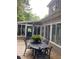 Outdoor patio features a table, chairs, and sunroom at 4150 Nature View Cir, Johns Island, SC 29455