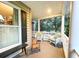 Cozy front porch featuring comfortable seating and views of the beautifully landscaped yard at 4150 Nature View Cir, Johns Island, SC 29455