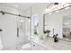 Modern bathroom with glass enclosed shower, sleek fixtures, and bright natural light at 42 Poinsett St # B, Charleston, SC 29403