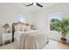 Inviting bedroom with two large windows, a ceiling fan and a cozy rug at 42 Poinsett St # B, Charleston, SC 29403