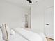 Bedroom with light hardwood floors and a door leading to another bedroom at 42 Poinsett St # B, Charleston, SC 29403