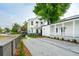 Charming two-story home with white siding, black trim, and modern landscaping at 42 Poinsett St # B, Charleston, SC 29403
