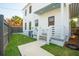 Front yard with a well manicured lawn, and view of the home's front entrance at 42 Poinsett St # B, Charleston, SC 29403