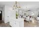 Modern kitchen showcasing an island with barstool seating, sleek countertops, and contemporary lighting fixtures at 42 Poinsett St # B, Charleston, SC 29403
