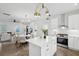Modern kitchen featuring an island, stainless steel appliances, and an open floor plan connecting to the dining and living areas at 42 Poinsett St # B, Charleston, SC 29403