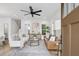 Open concept living room and stairwell are elegantly designed with neutral tones and natural light at 42 Poinsett St # B, Charleston, SC 29403