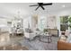 Open concept living room and dining area are elegantly designed with neutral tones and natural light at 42 Poinsett St # B, Charleston, SC 29403