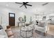 Open concept living room, dining, and foyer create a warm and inviting space with modern decor at 42 Poinsett St # B, Charleston, SC 29403