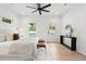 Bright main bedroom with a plush bed, stylish decor, and a door leading to the exterior, creating a tranquil retreat at 42 Poinsett St # B, Charleston, SC 29403